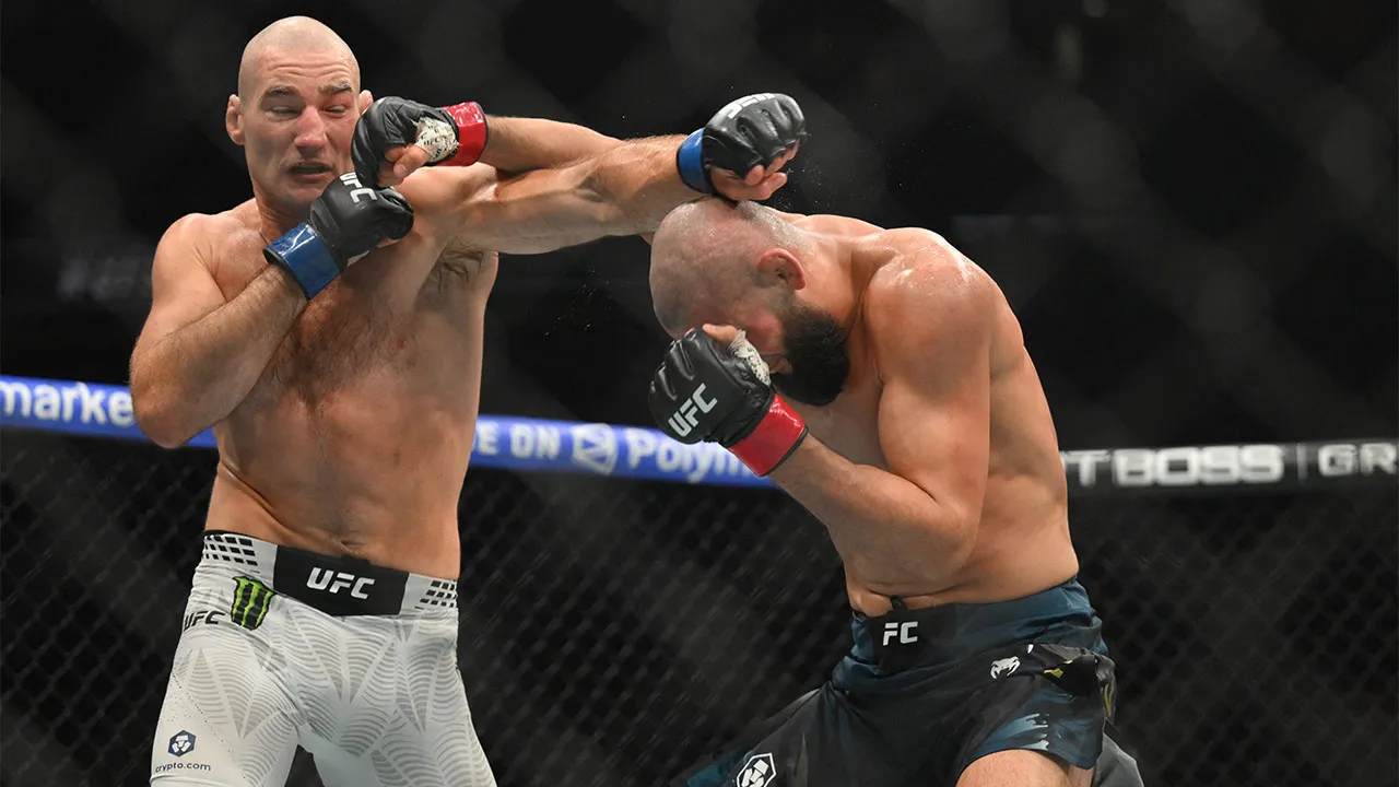May 9, 2026; Newark, New Jersey, UNITED STATES; Khamzat Chimaev (red gloves) fights Sean Strickland (blue gloves) during UFC 328 at Prudential Center. Mandatory Credit: John Jones-Imagn Images
