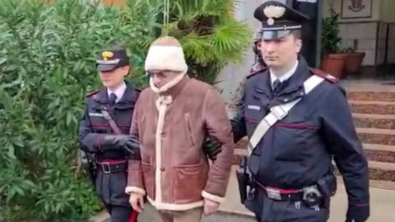 A screengrab taken from a video shows Matteo Messina Denaro the country's most wanted mafia boss being escorted out of a Carabinieri police station after he was arrested in Palermo, Italy, January 16, 2023. Carabinieri/Handout via REUTERS