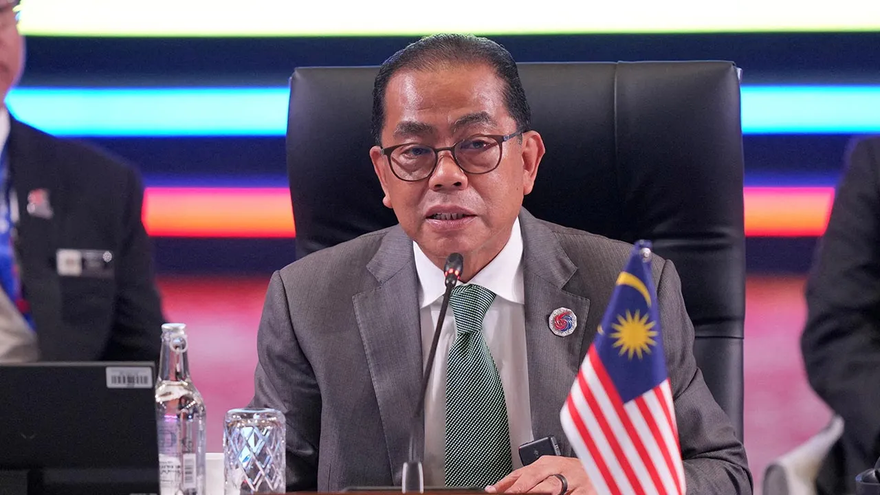FILE PHOTO: Malaysia's Defense Minister Mohamed Khaled Nordin delivers his remarks during the opening session of the Association of Southeast Asian Nations (ASEAN) Defense Ministers’ Meeting in Kuala Lumpur, Malaysia, Friday, Oct. 31, 2025. Dita Alangkara/Pool via REUTERS/File Photo