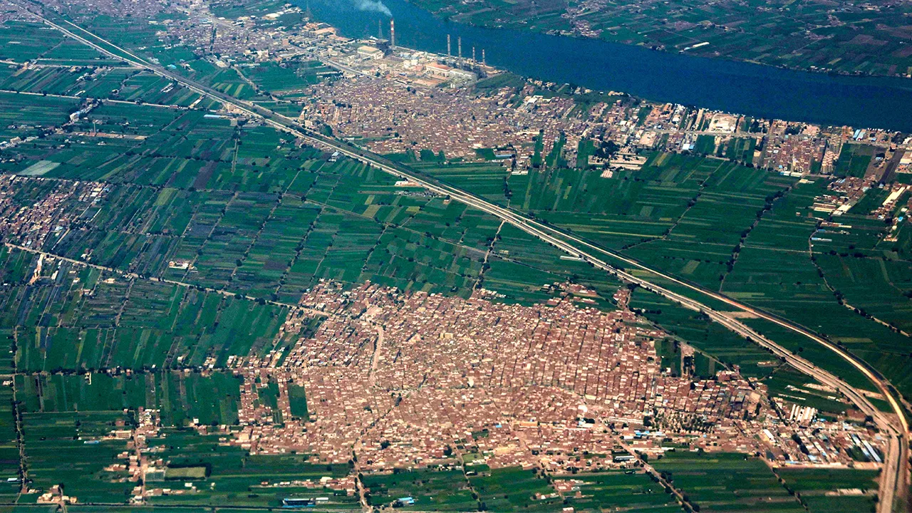 An aerial view of Egypt’s Nile Delta region, with smoke rising from the South Cairo Electricity Distribution Company power station and river branches winding through farmland north of Cairo, Egypt, March 31, 2026. REUTERS/Amr Abdallah Dalsh