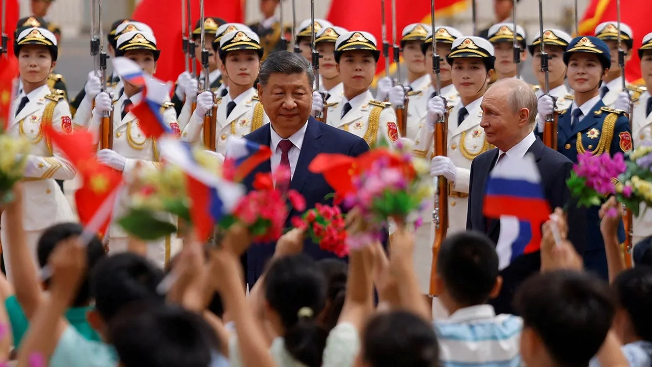 Russian President Vladimir Putin and Chinese President Xi Jinping attend a welcoming ceremony at the Great Hall of the People in Beijing, China May 20, 2026. REUTERS/Maxim Shemetov/Pool TPX IMAGES OF THE DAY