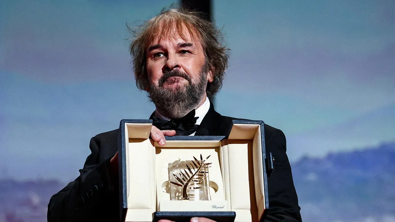 New Zealand filmmaker Peter Jackson poses as he receives an Honorary Palme d'Or Award during the opening ceremony and the screening of the film "La Venus electrique" (The Electric Kiss) Out of competition at the 79th Cannes Film Festival in Cannes, France, May 12, 2026. REUTERS/Gonzalo Fuentes 