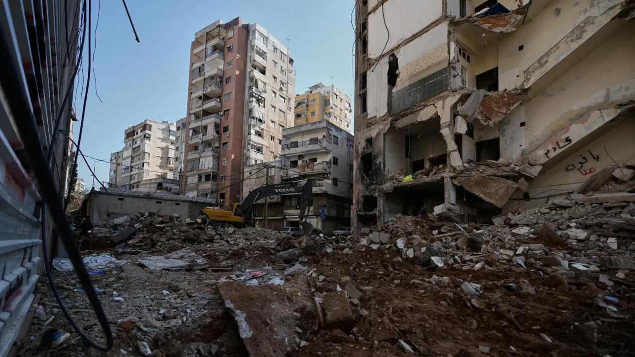 A bulldozer clears the rubble where a sports clothing shop was destroyed in a previous Israeli airstrike in Chiyah, a southern Beirut suburb, May 6, 2026. (Photo: AP/Bilal Hussein)
