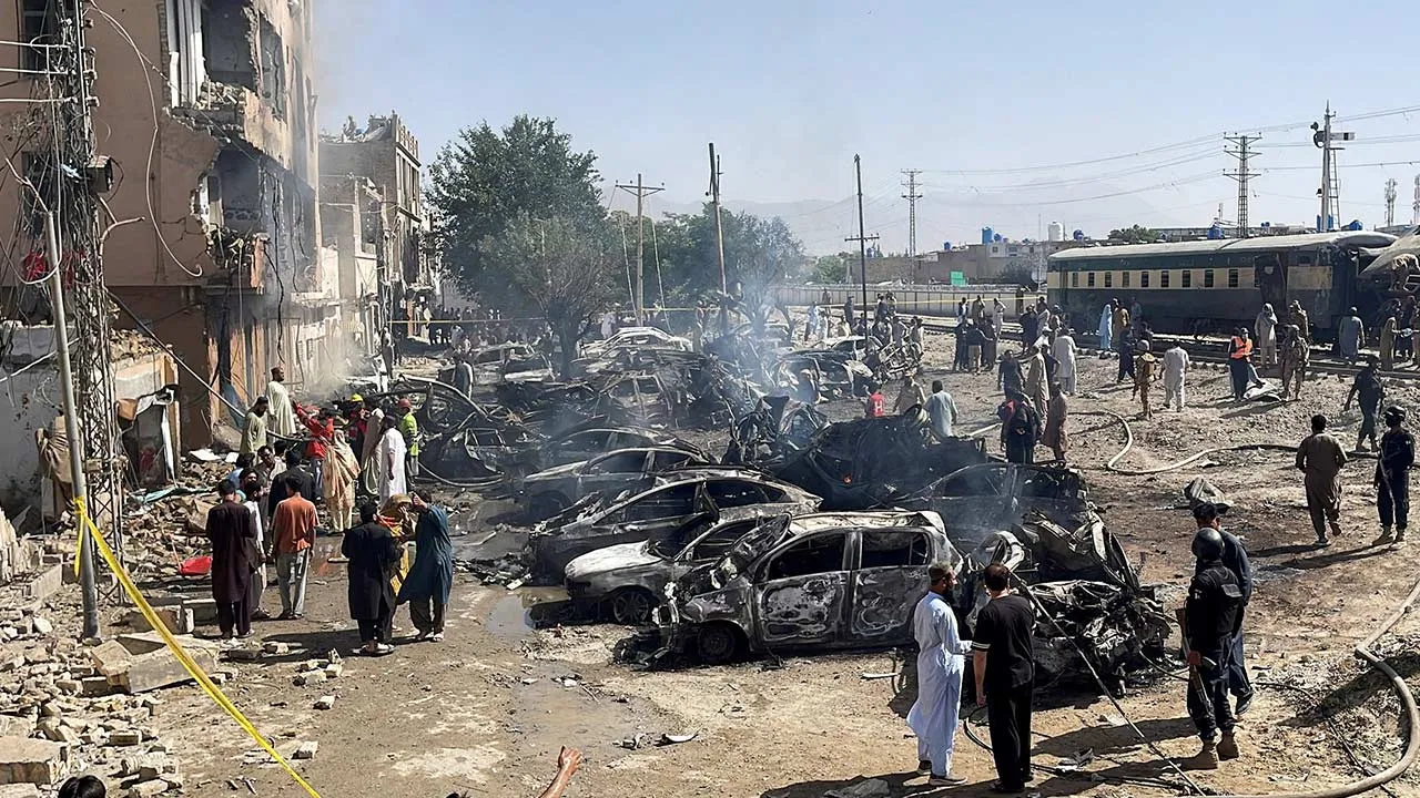 People and police officers gather after a blast near a railway track in Quetta, Pakistan, May 24, 2026. Picture taken with a mobile phone. REUTERS/Stringer TPX IMAGES OF THE DAY