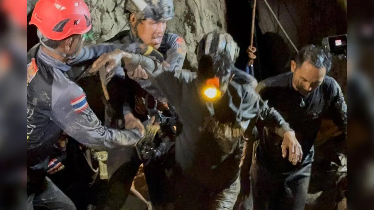 This image released by Metta Tham Rescue Kalasin, Rescuers evacuate the first of five villagers, center, who had been trapped in a cave in Xaisomboun province, Laos, Friday, May 29, 2026. (Metta Tham Rescue Kalasin via AP)