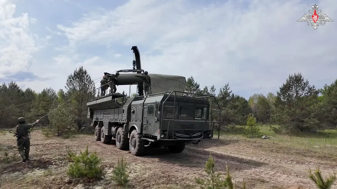 Service members mount a missile on a Russian Iskander-M missile launcher during nuclear forces exercises at an unidentified location in Belarus, in this still image taken from handout footage released on May 21, 2026. Russian Defence Ministry/Handout via REUTERS