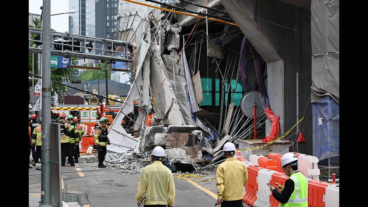 South Korean rescue team inspect the scene where an overpass collapsed while it was being dismantled in Seoul, South Korea, Tuesday, May 26, 2026. (Kim In-chul/Yonhap via AP)