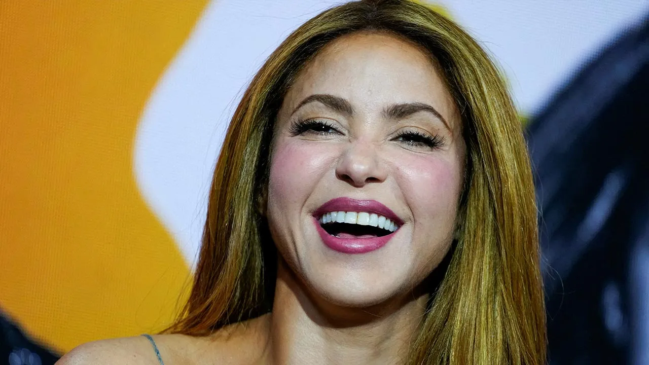 FILE PHOTO: Shakira smiles as she attends a press event organized by Global Citizen and FIFA to announce the FIFA World Cup Final Halftime Show in New York City, U.S., May 14, 2026. REUTERS/Eduardo Munoz/File Photo