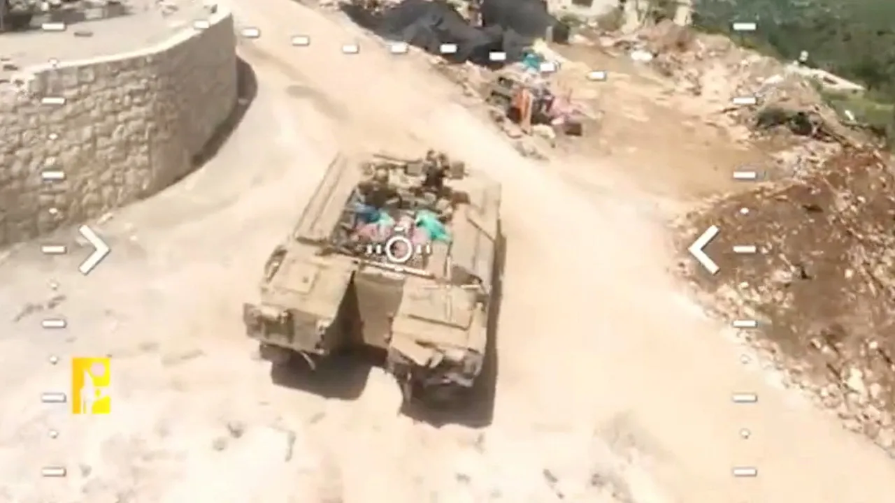 Footage released by Hezbollah claims to show an attack on an armored personnel carrier, carried out in Qantara, Lebanon, in this screengrab taken from a handout video released on April 28, 2026. Hezbollah Military Media/Handout via REUTERS THIS IMAGE HAS BEEN SUPPLIED BY A THIRD PARTY. OVERLAY FROM SOURCE. Verification lines : Reuters verified the location as Qantara, Lebanon, by the field, the building and the road layout seen in the video, which matched satellite imagery of the area. The date when the vid