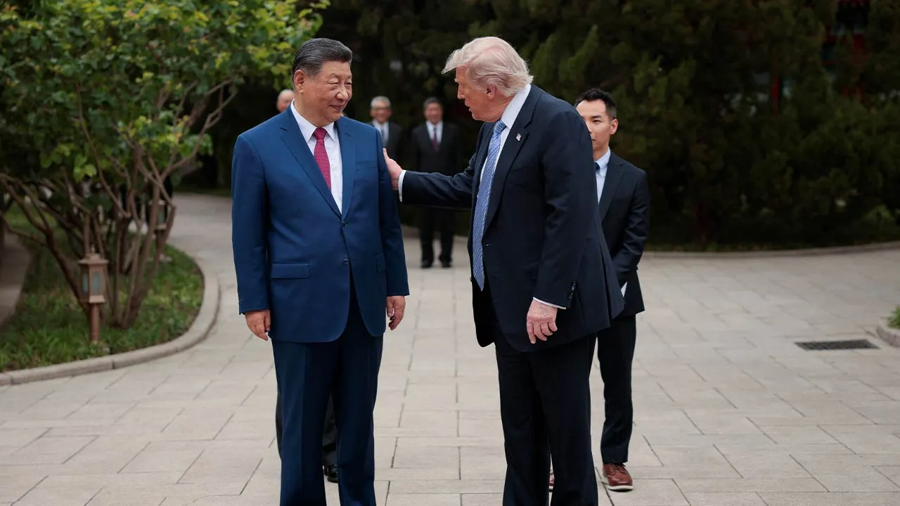 U.S. President Donald Trump speaks with Chinese President Xi Jinping while leaving after a visit to the Zhongnanhai Garden in Beijing, China, May 15, 2026. REUTERS/Evan Vucci/Pool