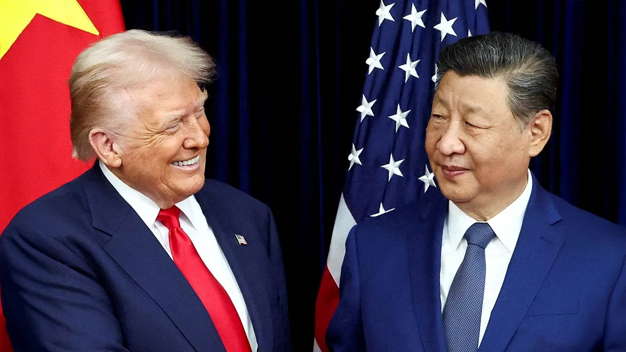 U.S. President Donald Trump and Chinese President Xi Jinping react as they hold a bilateral meeting at Gimhae International Airport, on the sidelines of the Asia-Pacific Economic Cooperation (APEC) summit, in Busan, South Korea, October 30, 2025. REUTERS/Evelyn Hockstein/File Photo