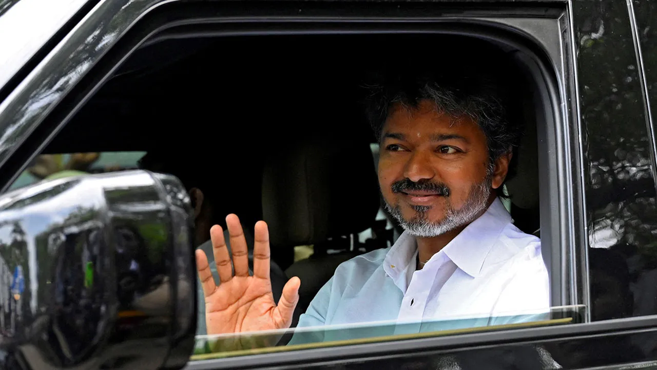 FILE PHOTO: Actor-turned-politician Vijay, president of Tamilaga Vettri Kazhagam (TVK), waves as he arrives at his party’s office, a day after the Tamil Nadu assembly election results, in Chennai, India, May 5, 2026. REUTERS/Riya Mariyam R/File Photo