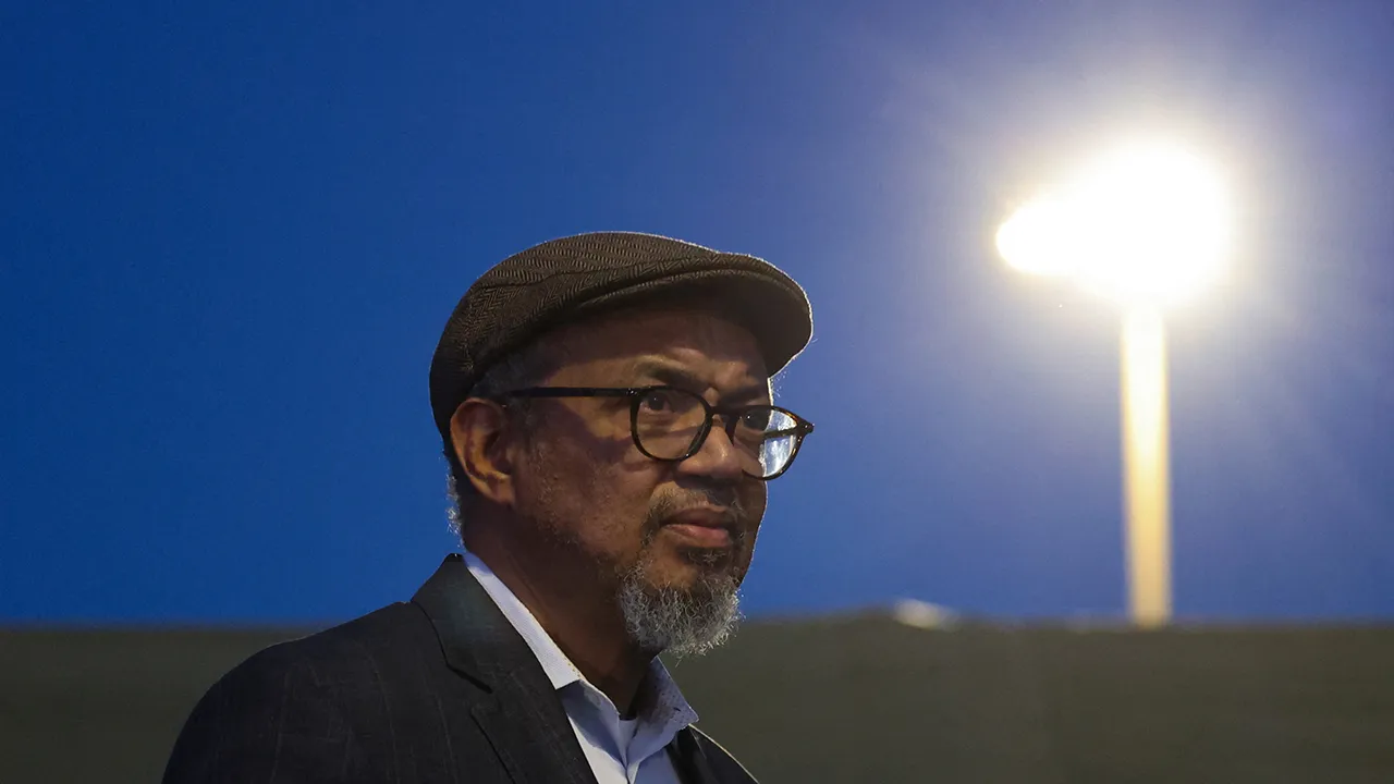 Director-General of the World Health Organisation, Tedros Adhanom, looks on as officials gather at the port of Granadilla de Abona, where the cruise ship MV Hondius is expected to dock after being affected by a hantavirus outbreak, in Tenerife, Spain, May 9, 2026. REUTERS/Hannah Mckay