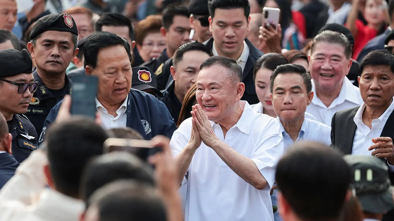 Former Thai Prime Minister Thaksin Shinawatra gestures following his release on parole after serving eight months of his one-year sentence at Klong Prem Central Prison, in Bangkok, Thailand, May 11, 2026. REUTERS/Chalinee Thirasupa