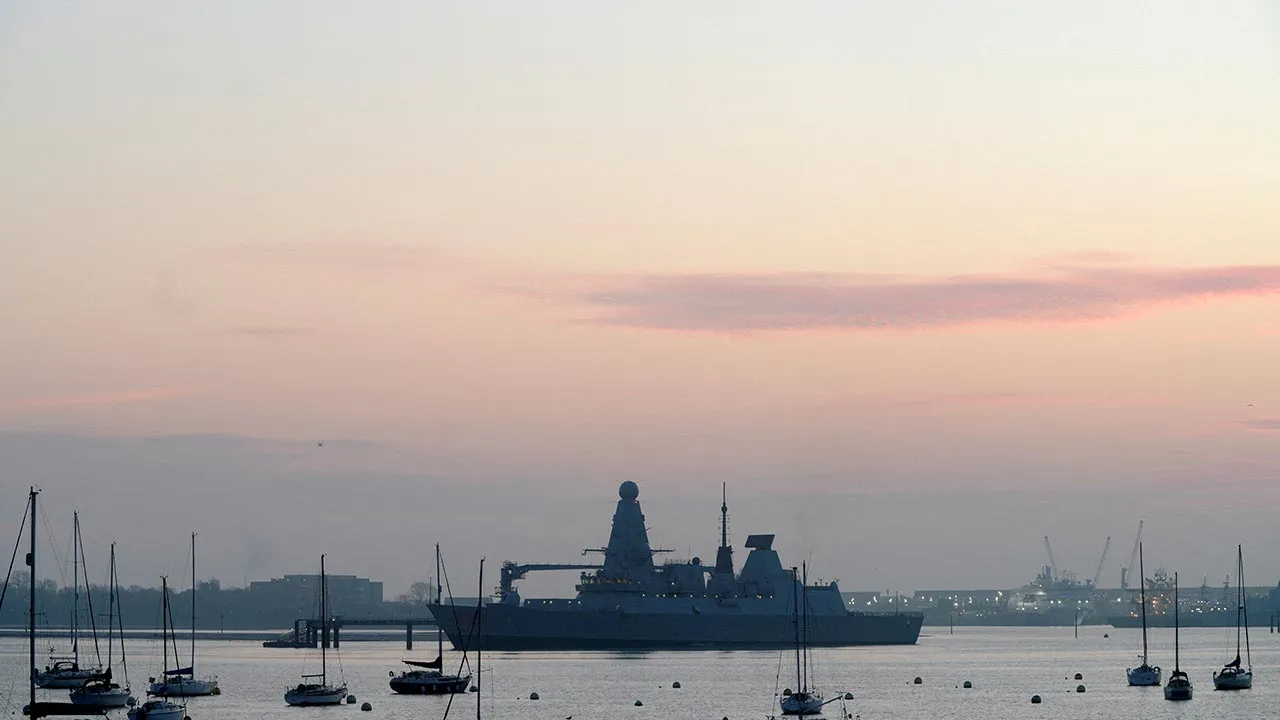 FILE PHOTO: The HMS Dragon during ammunitioning operations at Upper Harbour Ammunitioning Facility (UHAF) in Portsmouth Harbour, after British Prime Minister Keir Starmer announced that Britain would deploy the naval vessel, along with helicopters equipped with counter drone capabilities, to the eastern Mediterranean as the conflict in the Middle East intensifies, in Portsmouth, Britain March 4, 2026. REUTERS/Carlos Jasso/File Photo