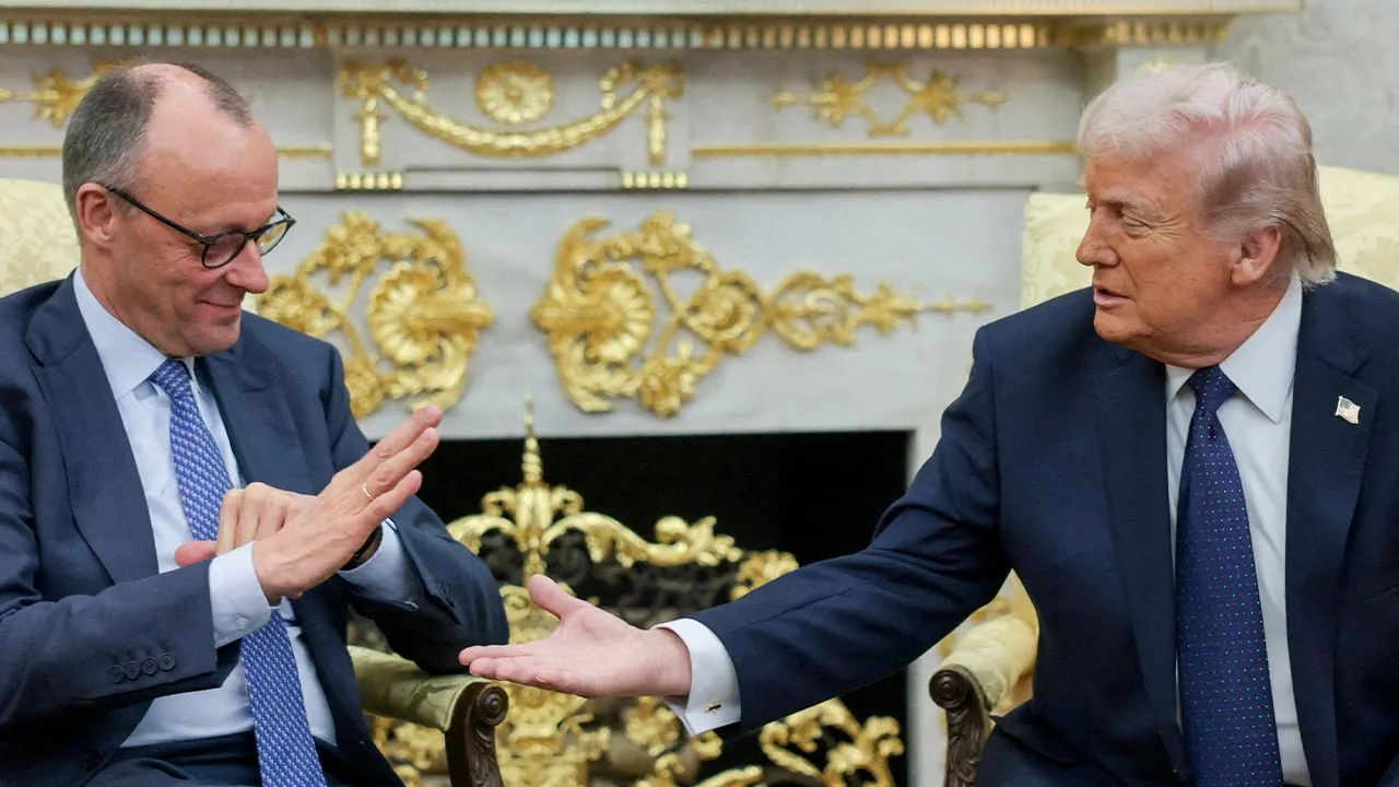 FILE PHOTO: U.S. President Donald Trump and German Chancellor Friedrich Merz reach to shake hands as they meet in the Oval Office at the White House in Washington, D.C., U.S., March 3, 2026. REUTERS/Jonathan Ernst/File Photo