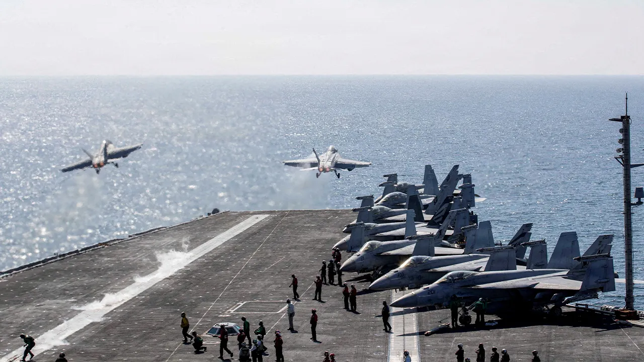 FILE PHOTO: Two F/A-18 Super Hornets launch from the flight deck of the U.S. Navy Nimitz-class aircraft carrier USS Abraham Lincoln in support of the Operation Epic Fury attack on Iran from an undisclosed location March 3, 2026. U.S. Navy/Handout via REUTERS THIS IMAGE HAS BEEN SUPPLIED BY A THIRD PARTY/File Photo