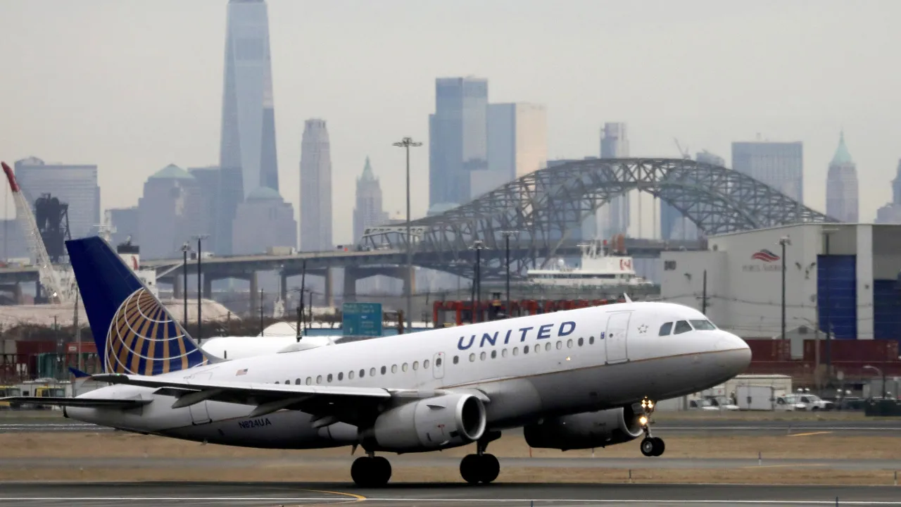 A United Airlines passenger jet takes off with New York City as a backdrop, at Newark Liberty International Airport, New Jersey, U.S. December 6, 2019. REUTERS/Chris Helgren 