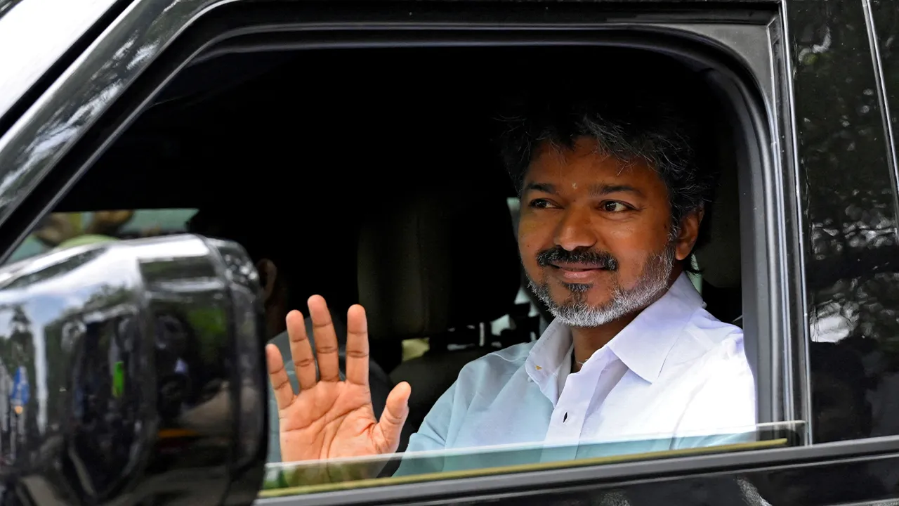 FILE PHOTO: Actor-turned-politician Vijay, president of Tamilaga Vettri Kazhagam (TVK), waves as he arrives at his party’s office, a day after the Tamil Nadu assembly election results, in Chennai, India, May 5, 2026. REUTERS/Riya Mariyam R/File Photo