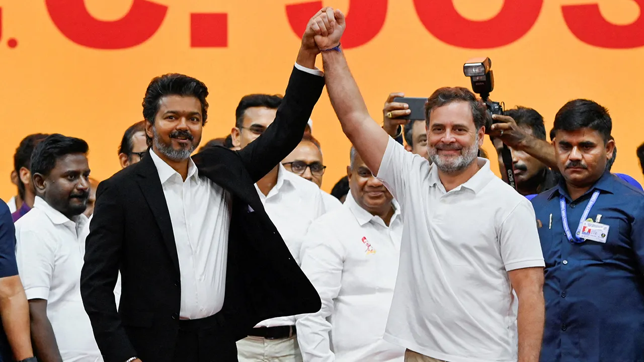 Tamil Nadu Chief Minister C. Joseph Vijay holds the hand of Congress leader Rahul Gandhi during a swearing-in ceremony as Chief Minister of Tamil Nadu at Jawaharlal Nehru Stadium, Chennai, India, May 10, 2026. REUTERS/Riya Mariyam R TPX IMAGES OF THE DAY