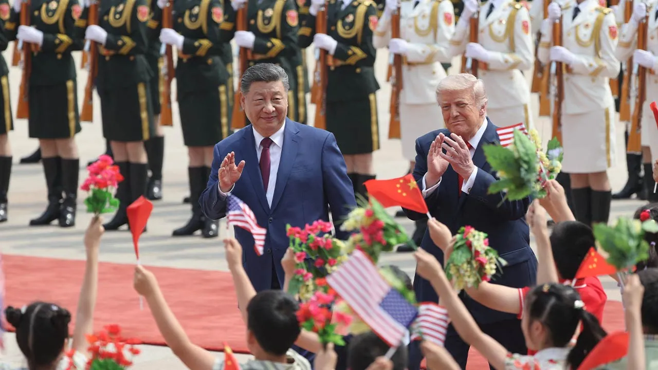 Chinese President Xi Jinping and U.S. President Donald Trump attend a welcome ceremony at the Great Hall of the People, in Beijing, China May 14, 2026. cnsphoto via REUTERS