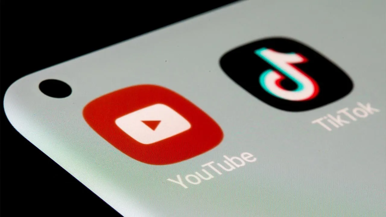 FILE PHOTO: YouTube and TikTok apps are seen on a smartphone in this illustration taken, July 13, 2021. REUTERS/Dado Ruvic/Illustration/File Photo