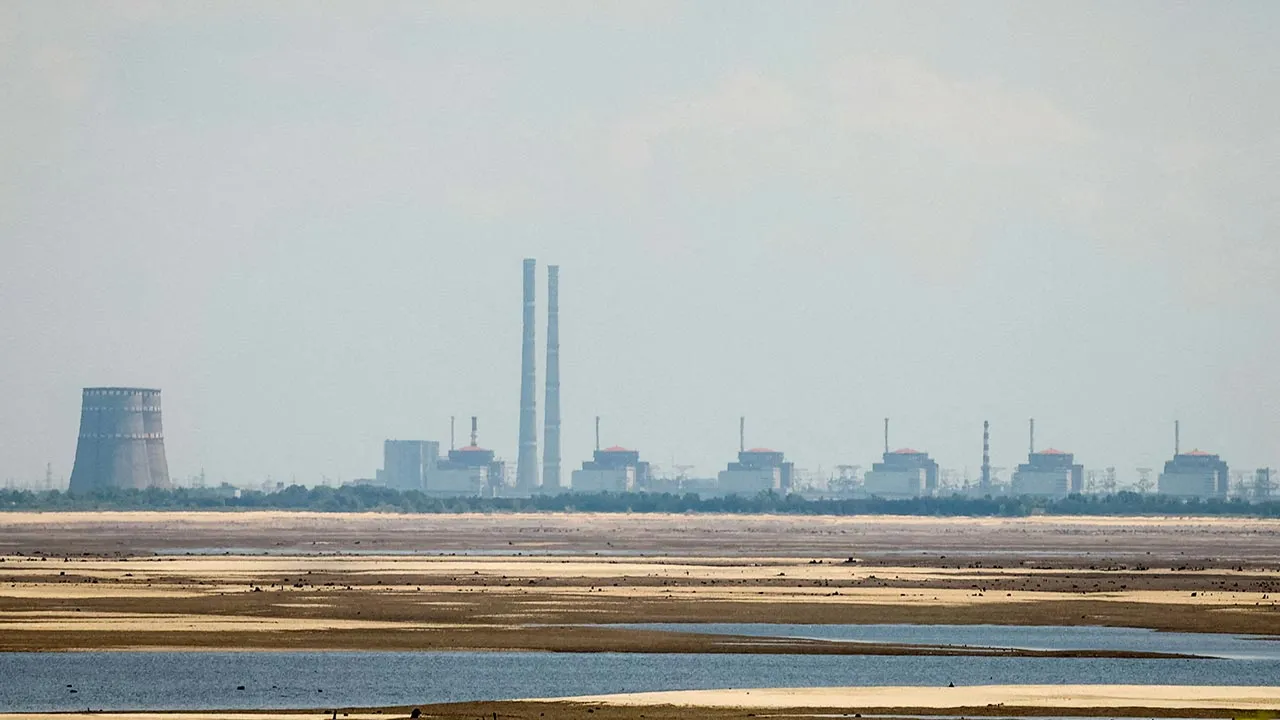 FILE PHOTO: A view shows Zaporizhzhia Nuclear Power Plant from the bank of Kakhovka Reservoir near the town of Nikopol after the Nova Kakhovka dam breached, amid Russia's attack on Ukraine, in Dnipropetrovsk region, Ukraine June 16, 2023. REUTERS/Alina Smutko/File Photo