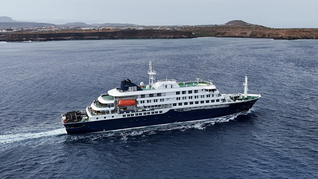 A drone view of the cruise ship MV Hondius, carrying passengers suspected of having cases of hantavirus on board, leaves Praia, Cape Verde, May 6, 2026. REUTERS/Stringer