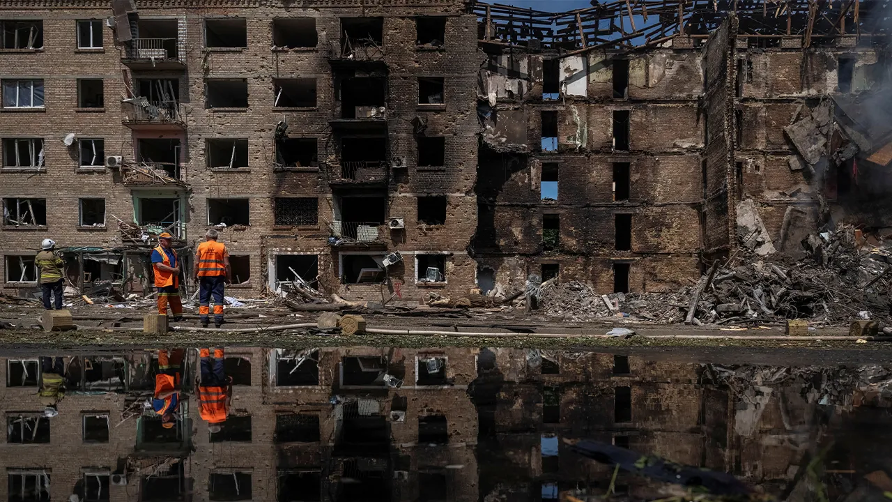 Communal workers clean an area at the site of a Russian missile and drone strike, amid Russia's attack on Ukraine, in Kyiv, Ukraine May 24, 2026. REUTERS/Viacheslav Ratynskyi