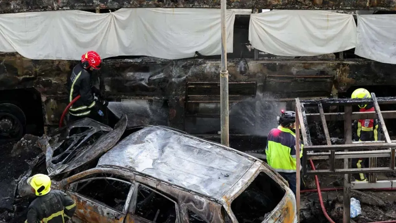 Emergency services work at a site where a train collided with a bus and several cars on Asok-Din Daeng Road, causing several casualties, in Bangkok, Thailand, May 16, 2026. [Athit Perawongmetha/Reuters] 