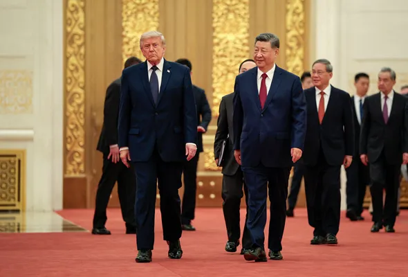 U.S. President Donald Trump and Chinese President Xi Jinping arrive to attend a state banquet at the Great Hall of the People in Beijing, China, May 14, 2026. REUTERS/Evan Vucci