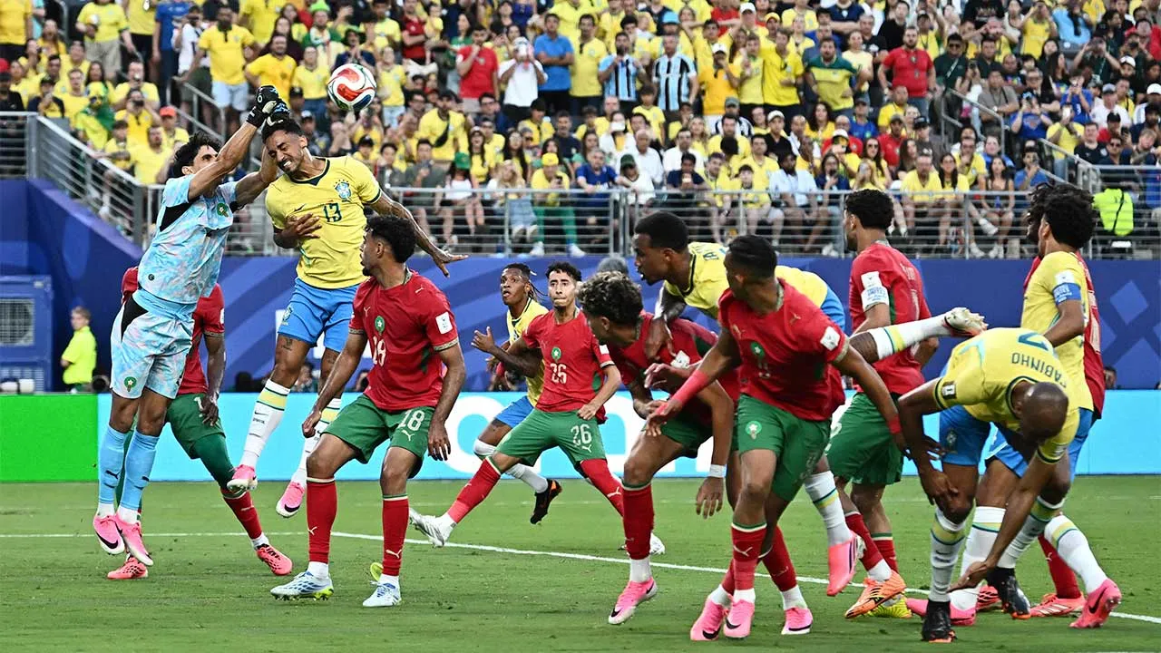 Soccer Football - FIFA World Cup 2026 - Group C - Brazil v Morocco - New York/New Jersey Stadium, East Rutherford, New Jersey, U.S. - June 13, 2026 Morocco's Yassine Bounou makes a save under pressure from Brazil's Danilo REUTERS/Dylan Martinez