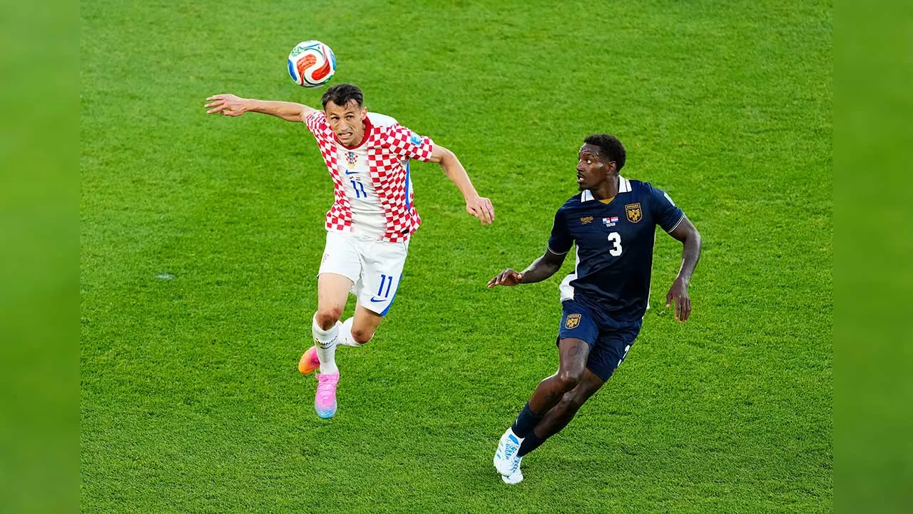 Croatia's Ante Budimir (11) heads the ball as Panama's Jose Cordoba (3) defends during the second half of a World Cup Group L soccer match, in Toronto, on Tuesday, June 23, 2026. (Chris Young/The Canadian Press via AP)