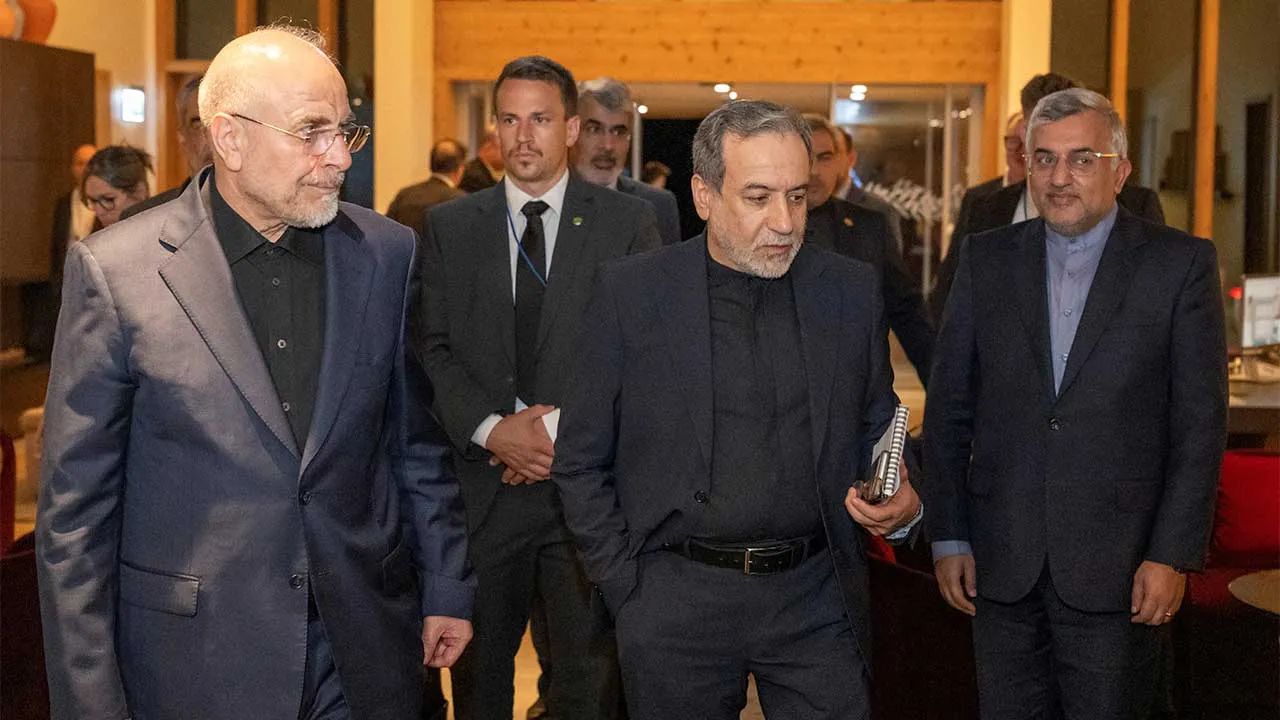 Minister of Foreign Affairs of Iran, Seyyed Abbas Araghchi, centre, and Speaker of the Islamic Parliament of Iran, Mohammad Bagher Ghalibaf, left, at the Buergenstock resort in Obbuergen, near Lucerne, Switzerland, Sunday, June 20, 2026. URS FLUEELER/Pool via REUTERS