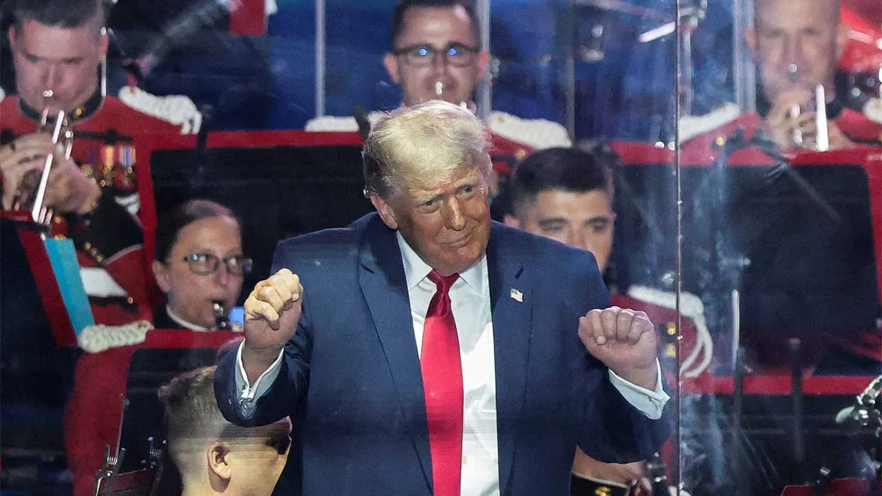 U.S. President Donald Trump gestures as the United States Marine Band performs at a rally to kick off the Great American State Fair in celebration of the 250th anniversary of U.S. independence on the National Mall in Washington, D.C., U.S., June 24, 2026. REUTERS/Evelyn Hockstein