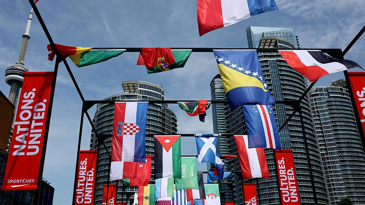 Soccer Football - FIFA World Cup 2026 - Toronto Harbour, Toronto, Canada - June 11, 2026 The flags of participating countries are pictured at the fan zone on the Toronto harbourfront as the CN Tower is seen in the background REUTERS/Bernadett Szabo
