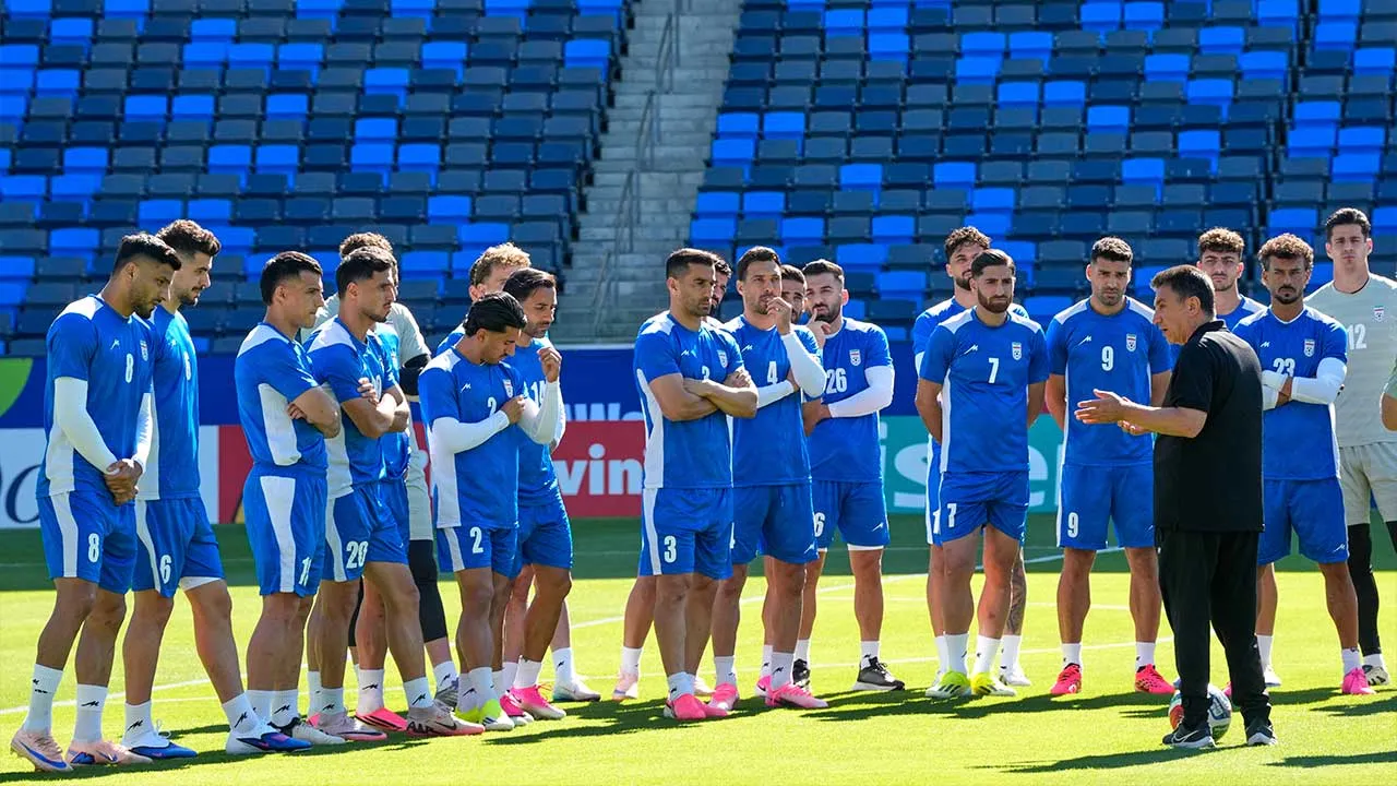 Iranian players listen to head coach Amir Ghalenoei during a training session ahead of their FIFA World Cup match against Belgium in Carson, Calif., Saturday, June 20, 2026. (AP Photo/Andre Penner)