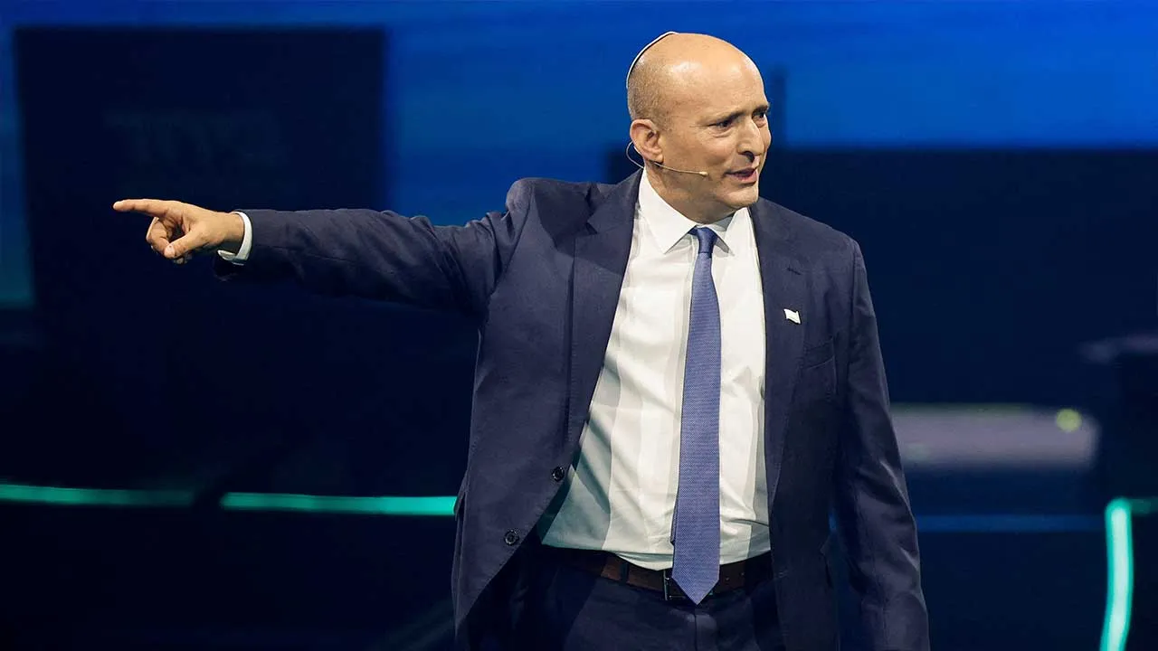 FILE PHOTO: Israeli right-wing politician Naftali Bennett gestures during a joint conference with centrist Yair Lapid for their new party "BeYachad", meaning "together" in Hebrew, in Tel Aviv, Israel, May 12, 2026. REUTERS/Amir Cohen/File Photo