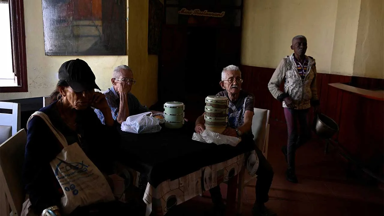 A group of elderly people wait at a dining hall to receive food assistance through the Sistema de Atencion a la Familia (SAF) system in Havana, Cuba, March 10, 2026. Pensions in Cuba have shrunk to the equivalent of $7 a month on the black-market exchange, as the peso has lost about a third of its value against the dollar since the start of the blockade. REUTERS/Norlys Perez TPX IMAGES OF THE DAY SEARCH "NORLYS CUBA ELDERLY" FOR THIS STORY. SEARCH "WIDER IMAGE" FOR ALL STORIES.