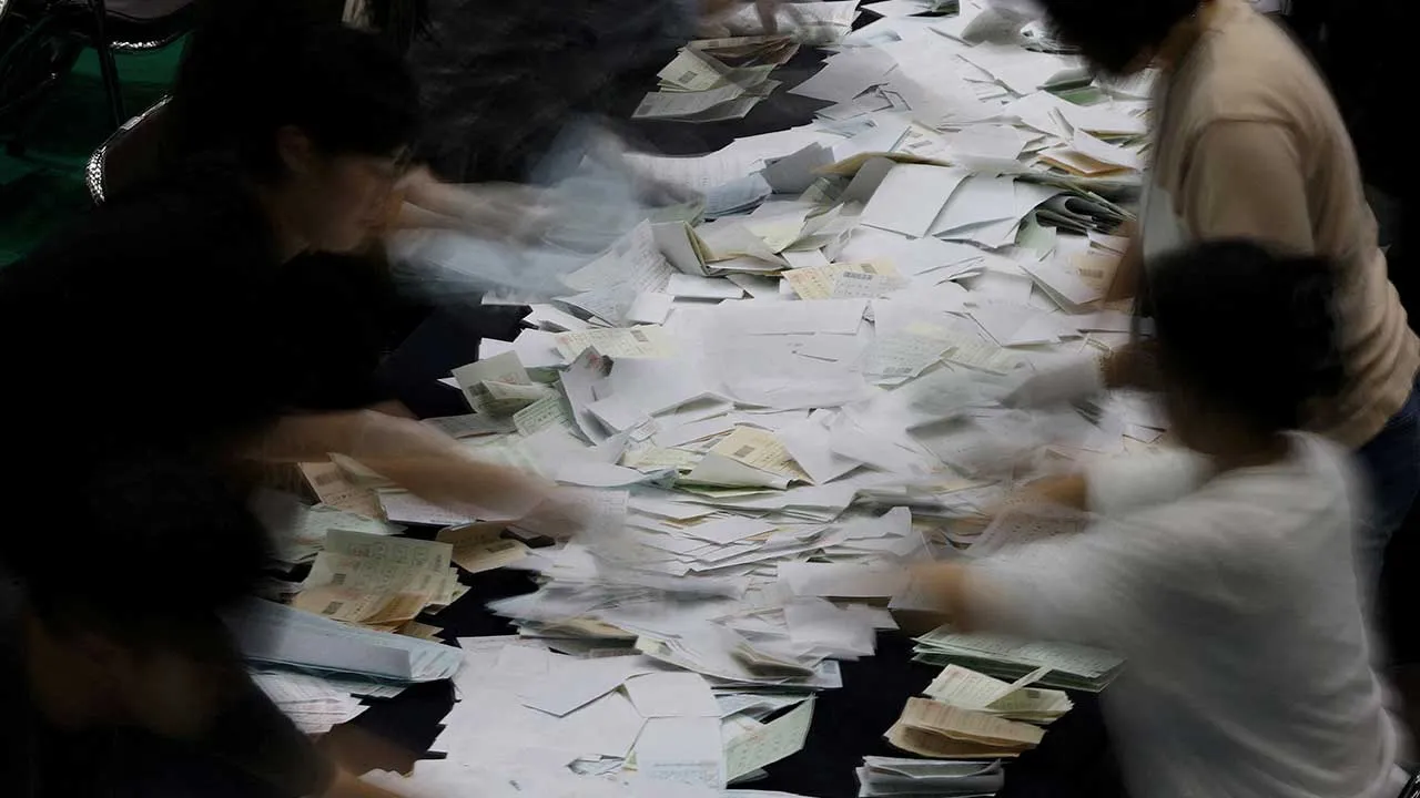 Election officials count the ballots for local elections in Seoul, South Korea, June 3, 2026. Picture taken with a long exposure. REUTERS/Kim Hong-Ji TPX IMAGES OF THE DAY