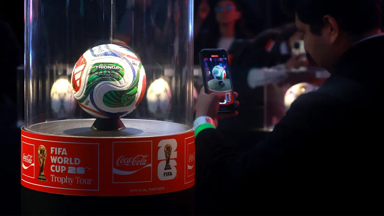 Soccer Football - FIFA World Cup 2026 - Trophy arrives in Mexico City - Mexico City, Mexico - June 5, 2026 A man takes a photo of a football during the trophy tour event REUTERS/Henry Romero