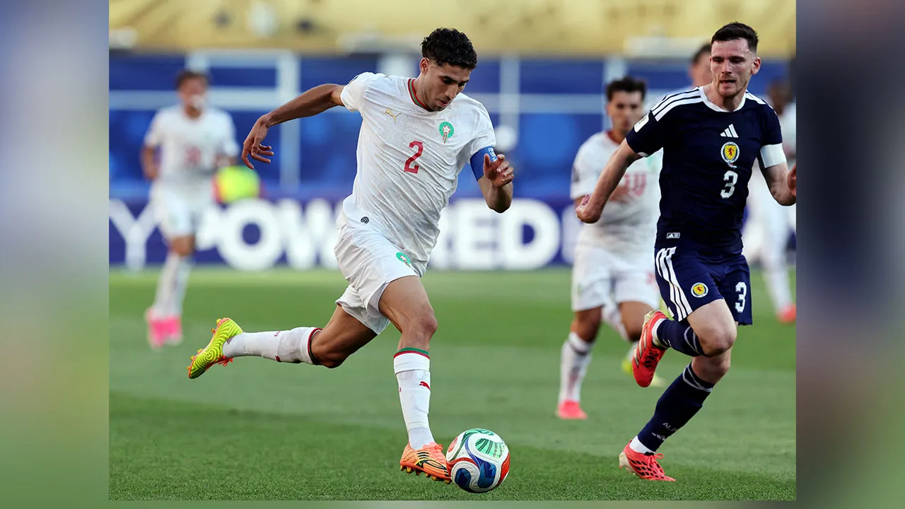 Soccer Football - FIFA World Cup 2026 - Group C - Scotland v Morocco - Boston Stadium, Foxborough, Massachusetts, U.S. - June 19, 2026 Morocco's Achraf Hakimi in action with Scotland's Andy Robertson IMAGN IMAGES via Reuters/Paul Rutherford