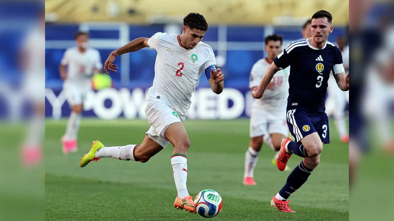 Soccer Football - FIFA World Cup 2026 - Group C - Scotland v Morocco - Boston Stadium, Foxborough, Massachusetts, U.S. - June 19, 2026 Morocco's Achraf Hakimi in action with Scotland's Andy Robertson IMAGN IMAGES via Reuters/Paul Rutherford
