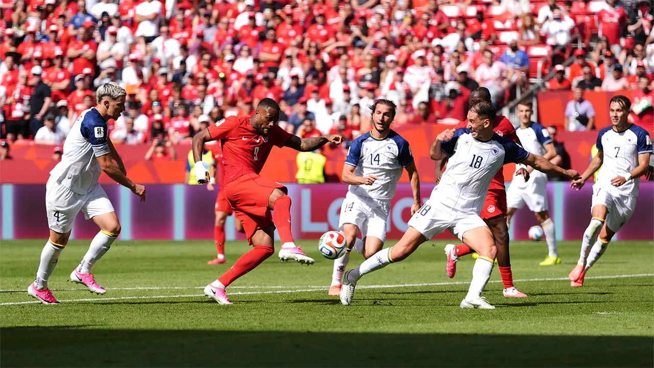 Canada's Cyle Larin (9) scores his sides first goal of the game in the second half of the World Cup Group B soccer match between Canada and Bosnia, Friday, June 12, 2026, in Toronto. (AP Photo/Sam Balkansky)