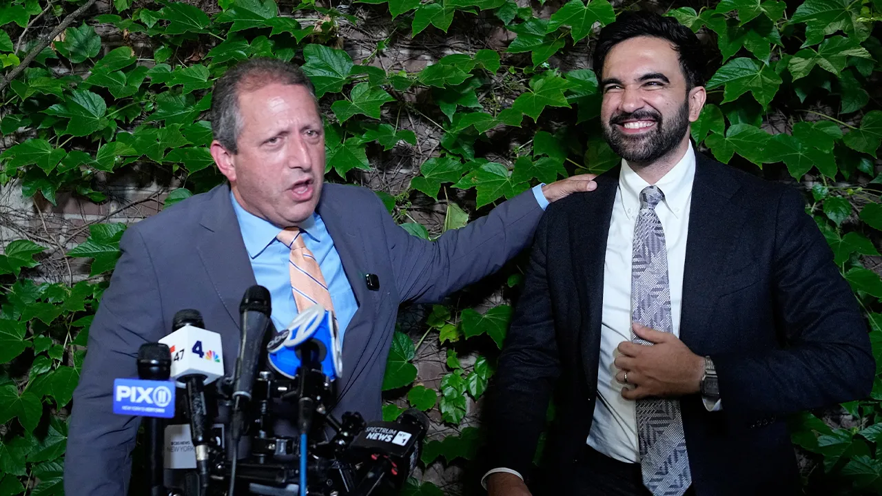 Brad Lander, candidate for New York’s 10th Congressional District, speaks to the media while standing next to New York City Mayor Zohran Mamdani during a watch party after winning the primary elections in Brooklyn, New York, U.S., June 23, 2026. REUTERS/Eduardo Munoz