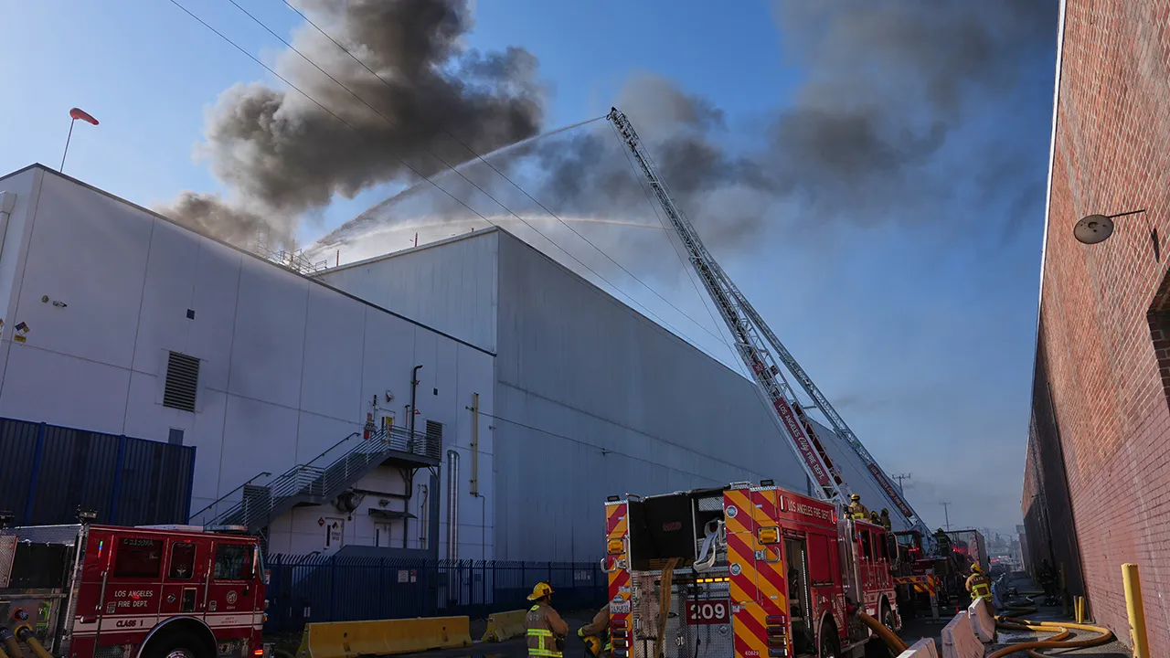 Crews work a warehouse fire in the Boyle Heights section of Los Angeles on Wednesday, June 17, 2026.