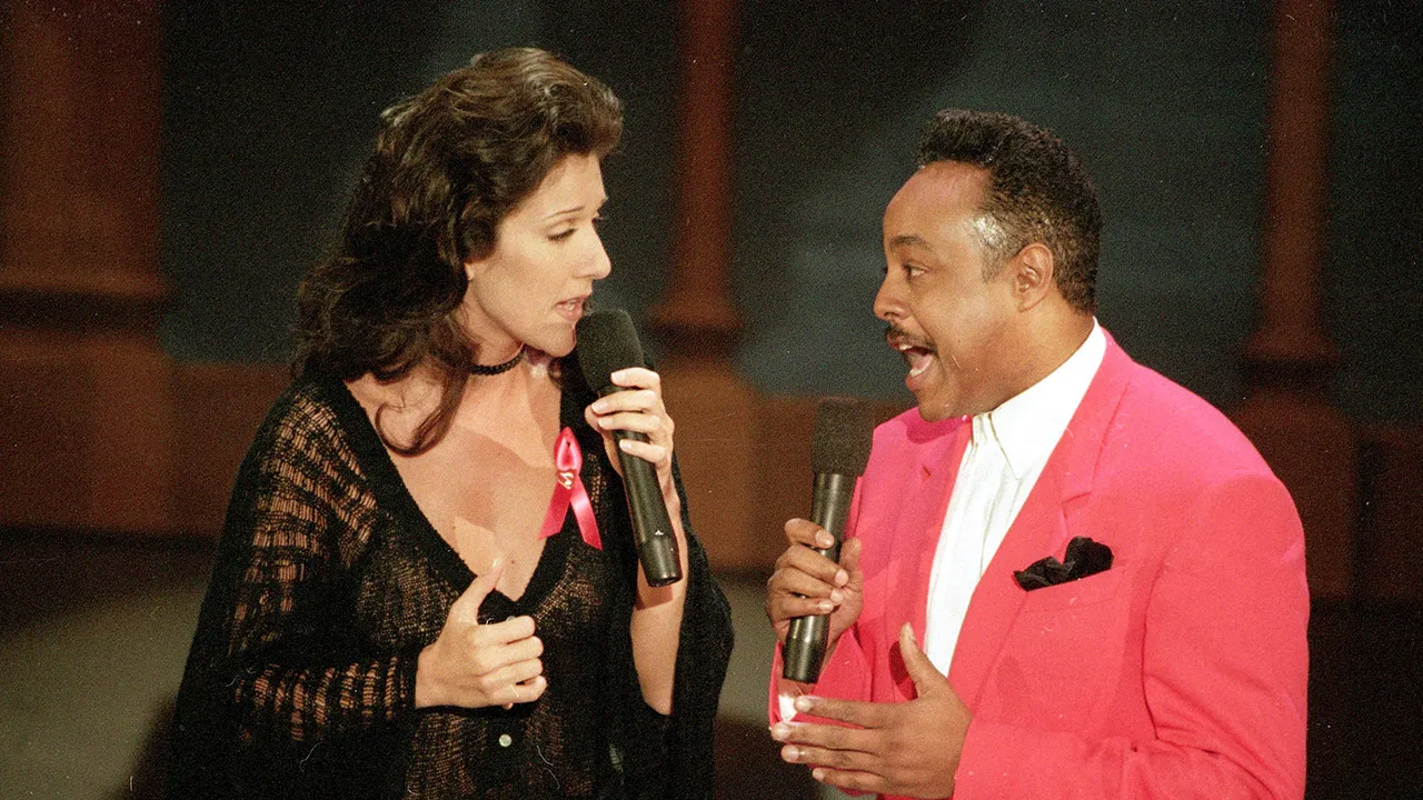 Celine Dion, left, and Peabo Bryson perform the song "Beauty and the Beast," that won them the Grammy for Best Pop Vocal Performance by a Group or Duo, at the 35th annual Grammy Awards in Los Angeles, Calif., Feb. 25, 1993. (AP Photo/Reed Saxon, File)