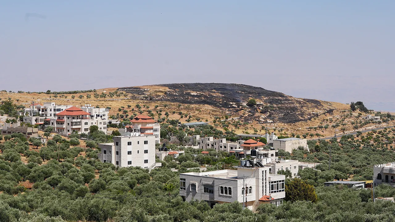 A burned hilltop near the Christian Taybeh village in the Israeli-occupied West Bank, June 10, 2026. REUTERS/Ali Sawafta TPX IMAGES OF THE DAY