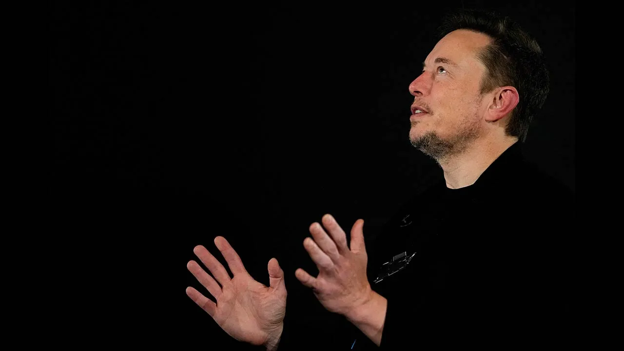 FILE PHOTO: Tesla and SpaceX's CEO Elon Musk reacts during an in-conversation event with British Prime Minister Rishi Sunak in London, Britain, November 2, 2023. Kirsty Wigglesworth/Pool via REUTERS/File Photo