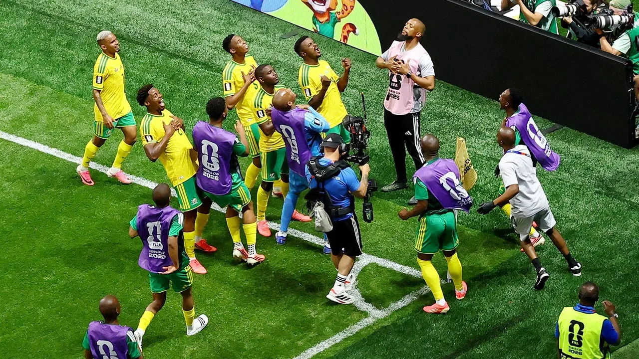 Soccer Football - FIFA World Cup 2026 - Group A - Czech Republic v South Africa - Atlanta Stadium, Atlanta, Georgia, U.S. - June 18, 2026 South Africa's Teboho Mokoena celebrates scoring their first goal from the penalty spot with teammates REUTERS/Bernadett Szabo